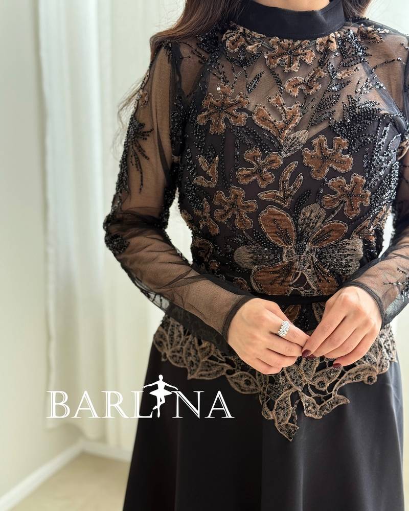 Black set with a high collar and gold embroidery