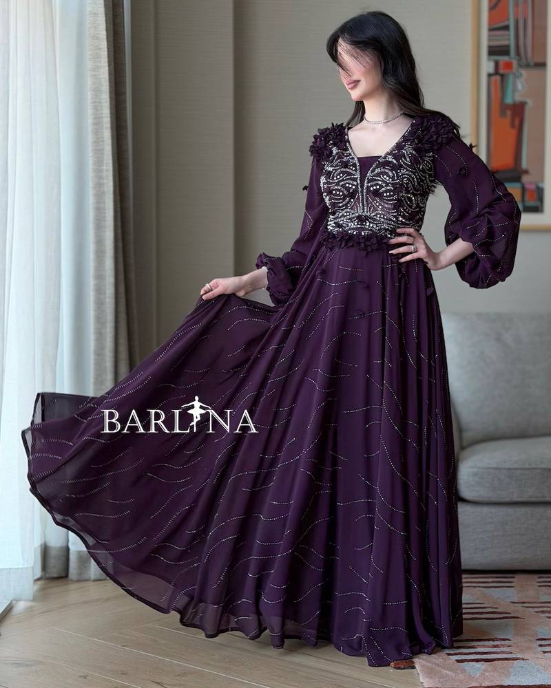 A purple flared dress embroidered with silver beads
