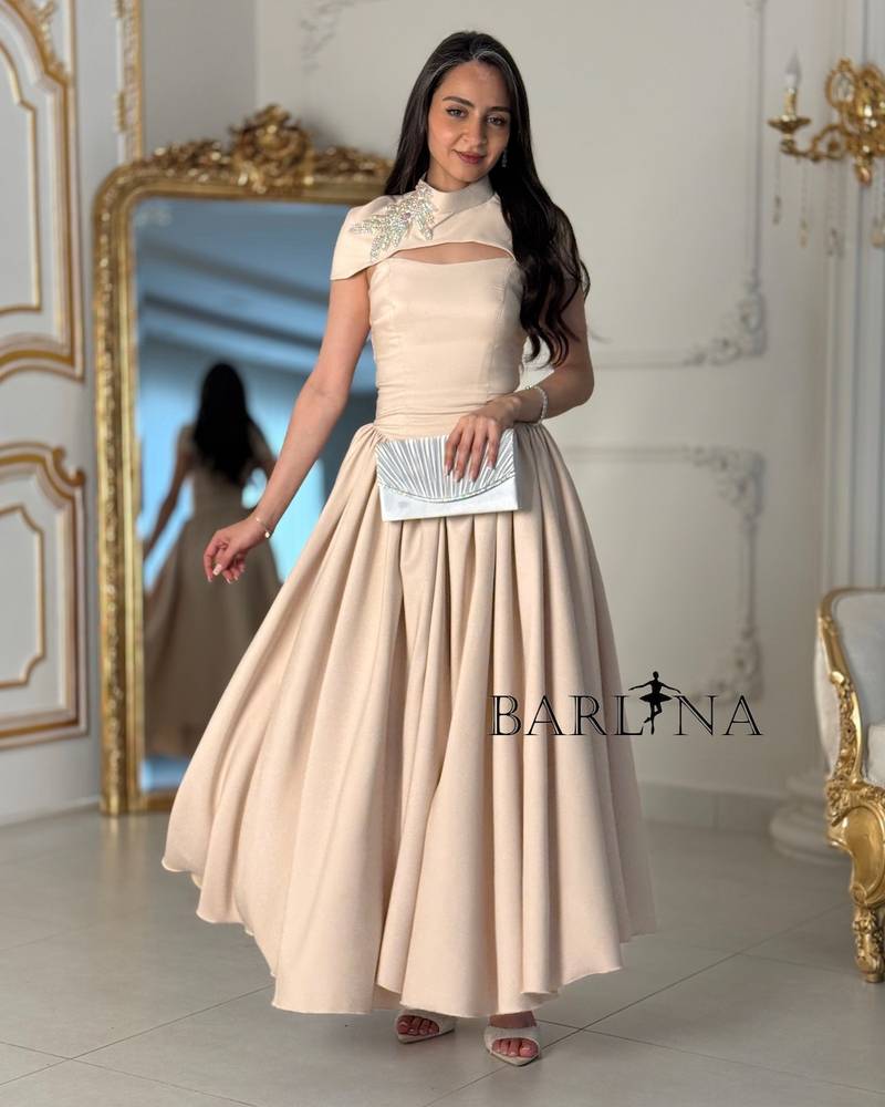 Beige flowing dress with a soft slit at the chest