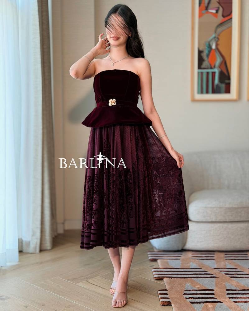 Burgundy peplum dress with a gold flower belt