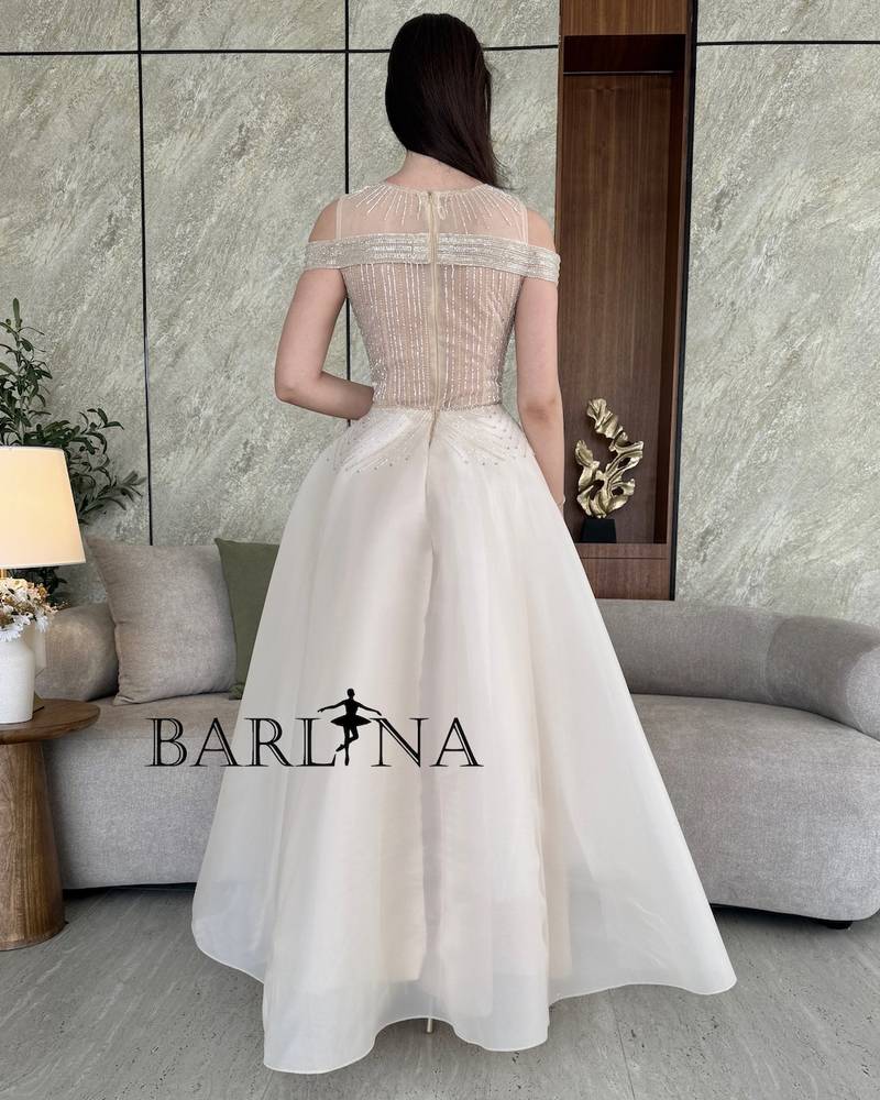 Light beige evening dress with royal embroidery