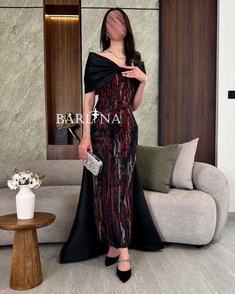 Black evening dress with a tail in the back