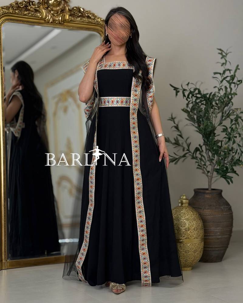 Black jalabiya with colorful traditional embroidery