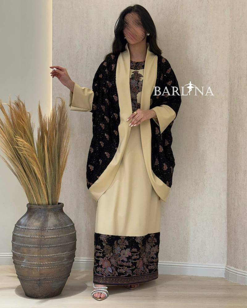 Beige jalabiya with a black floral jacket