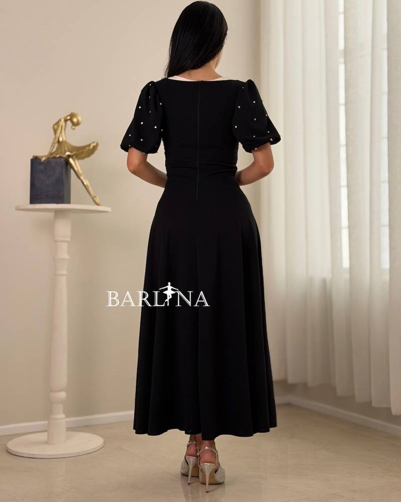 Classic black dress with a crystal waist bow