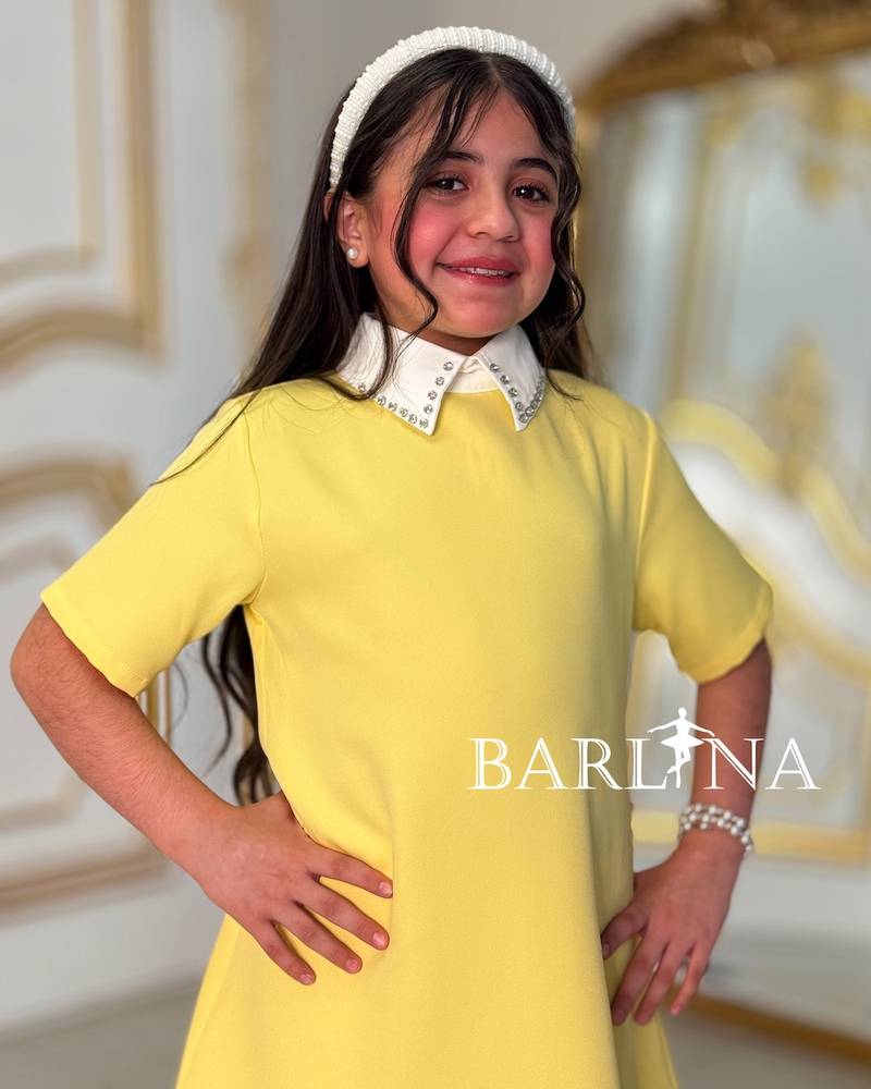 Soft yellow girls' dress with a white collar