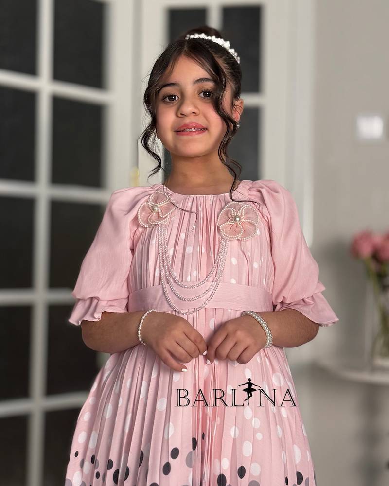 Girls' pink dress with elegant polka dot details