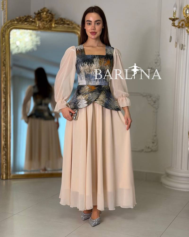 Beige dress with artistic patterns and sheer sleeves