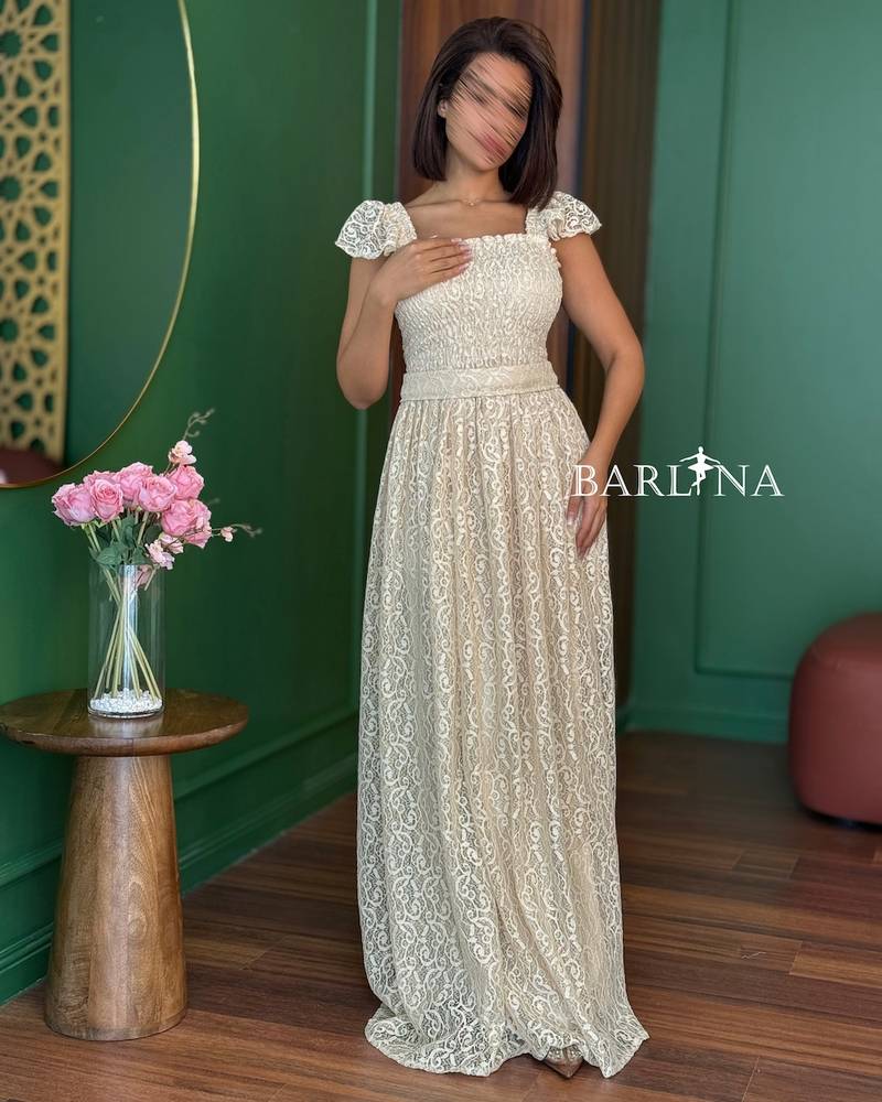 Beige lace dress with a gathered bodice