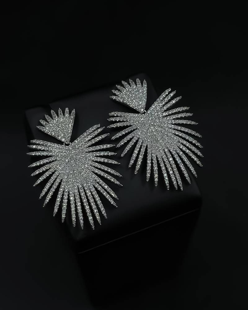 Silver evening earrings in a shimmering ray design