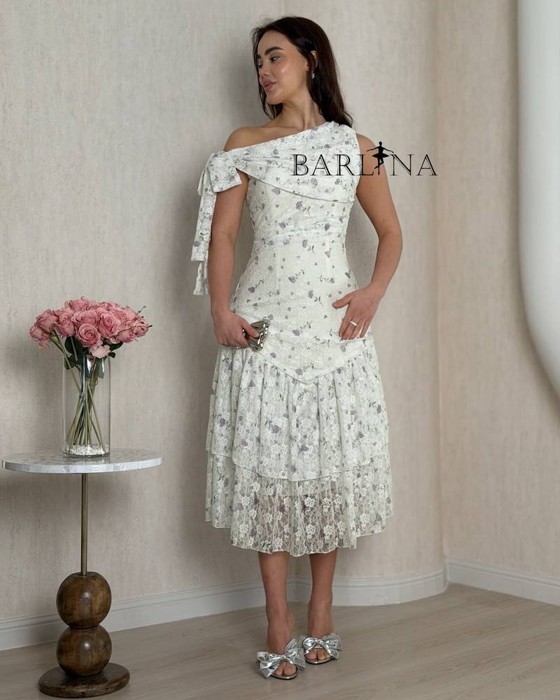 A dress with delicate details and light lace layers
