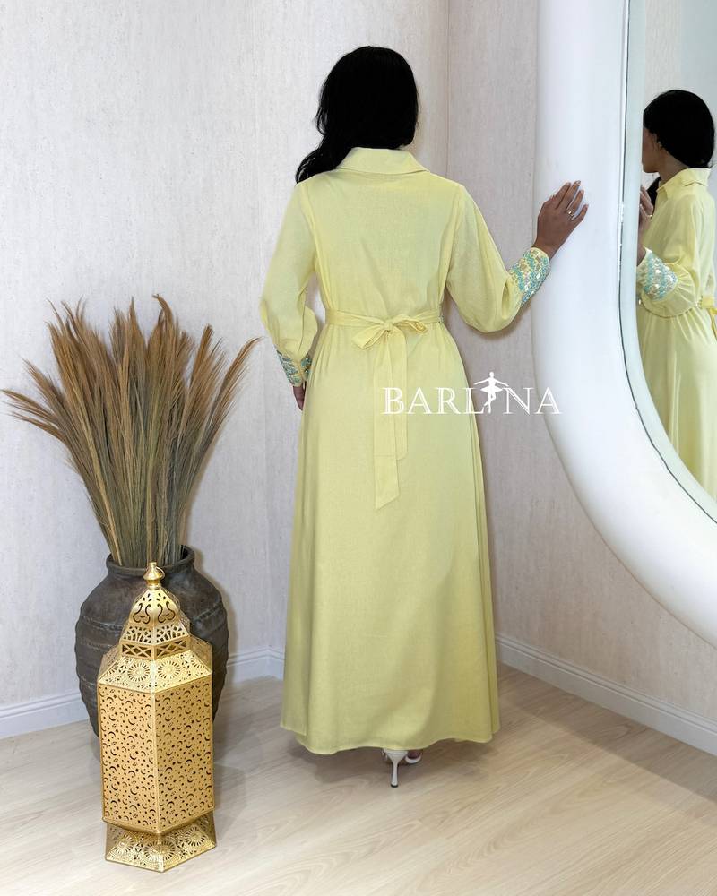 Yellow jalabiya with turquoise embroidery at the waist