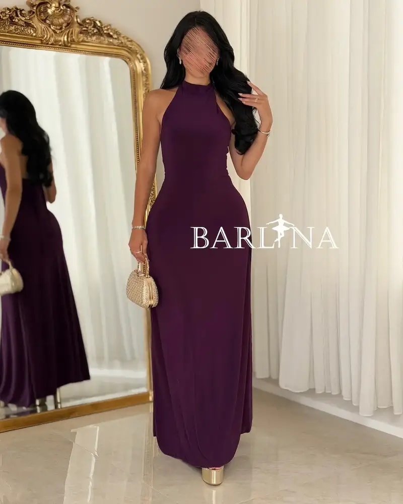 A purple dress with a fitted silhouette and a high neckline.