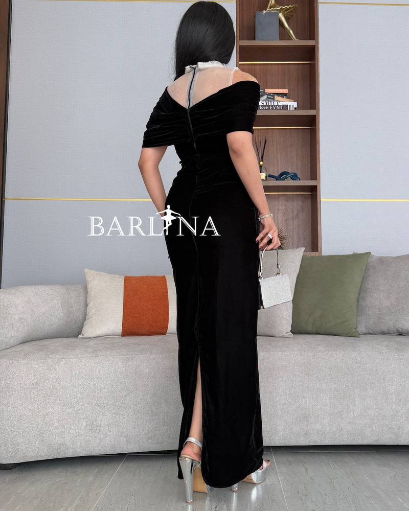 Black dress with high collar embroidered with sequins
