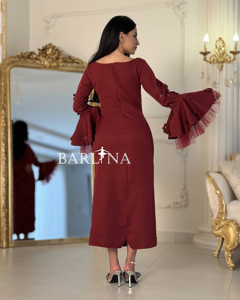 Burgundy dress with wide sleeves adorned with roses