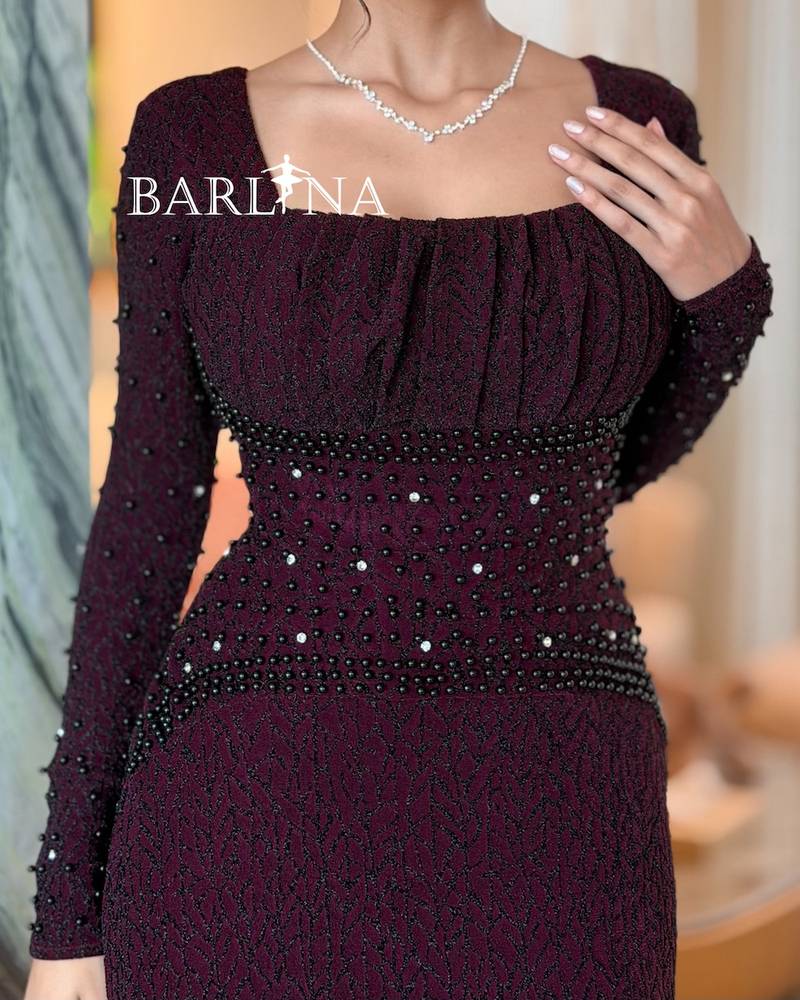 Burgundy dress with a square neckline adorned with pleats