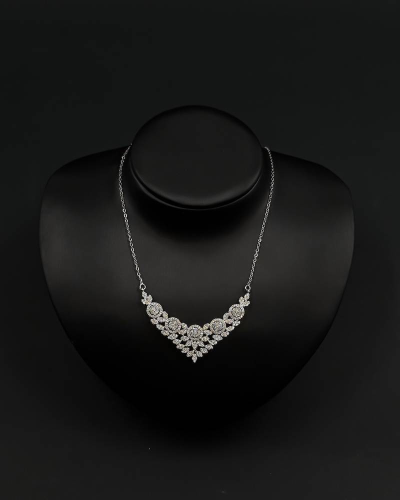 A delicately designed accessory set with a jeweled watch.