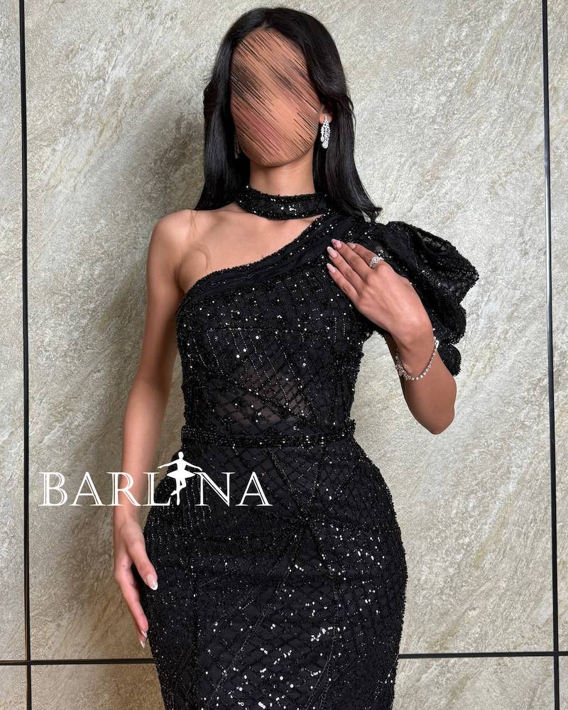 Black one-shoulder shiny dress with front slit