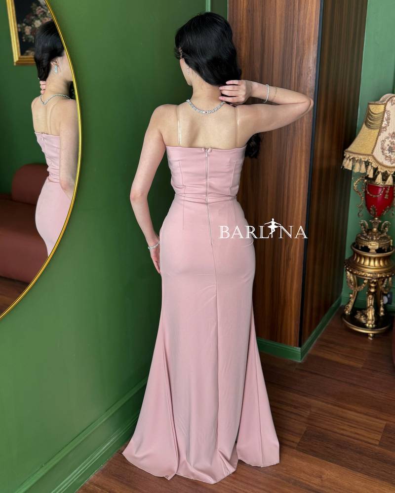 A pink dress with delicate details and elegant pleats