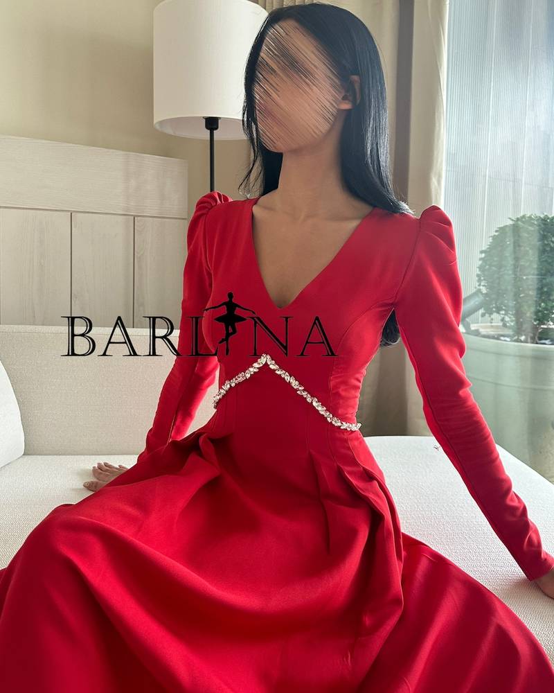 Classic red dress decorated with crystals with long sleeves