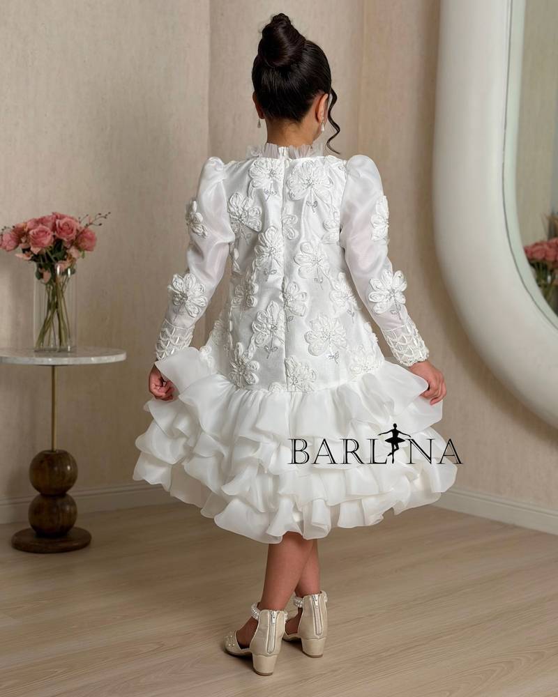 A white girl's dress decorated with raised roses