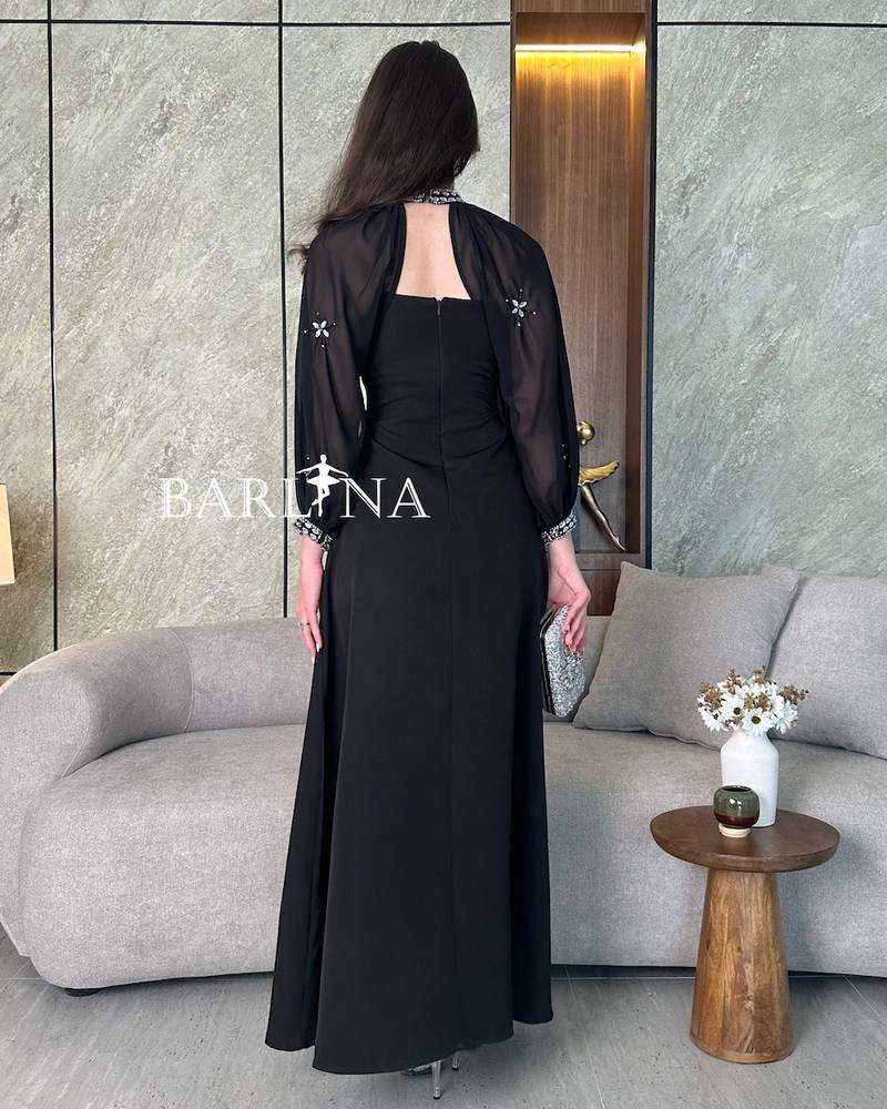 Luxury black dress with sheer sleeves