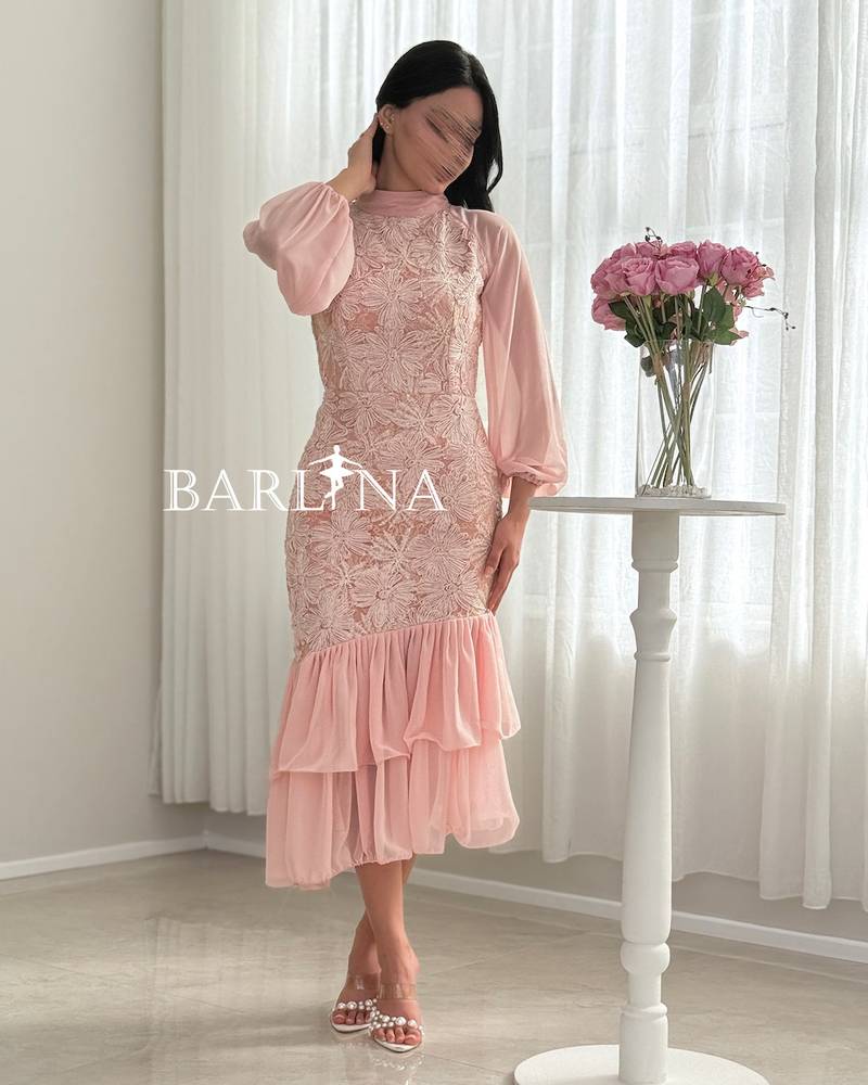 A soft pink dress with elegant embroidery