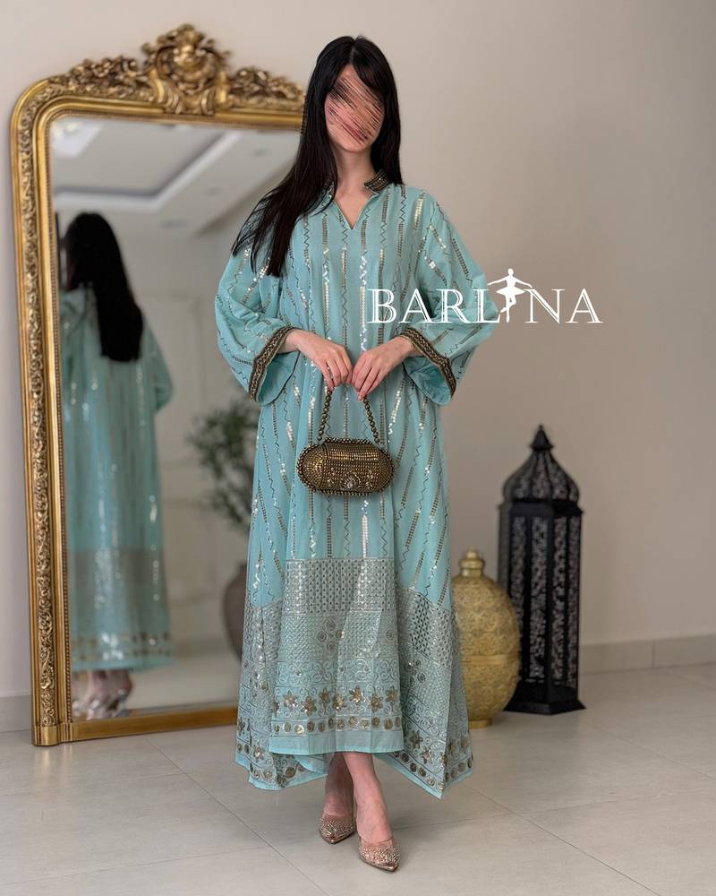 Turquoise jalabiya with shimmering gold embroidery