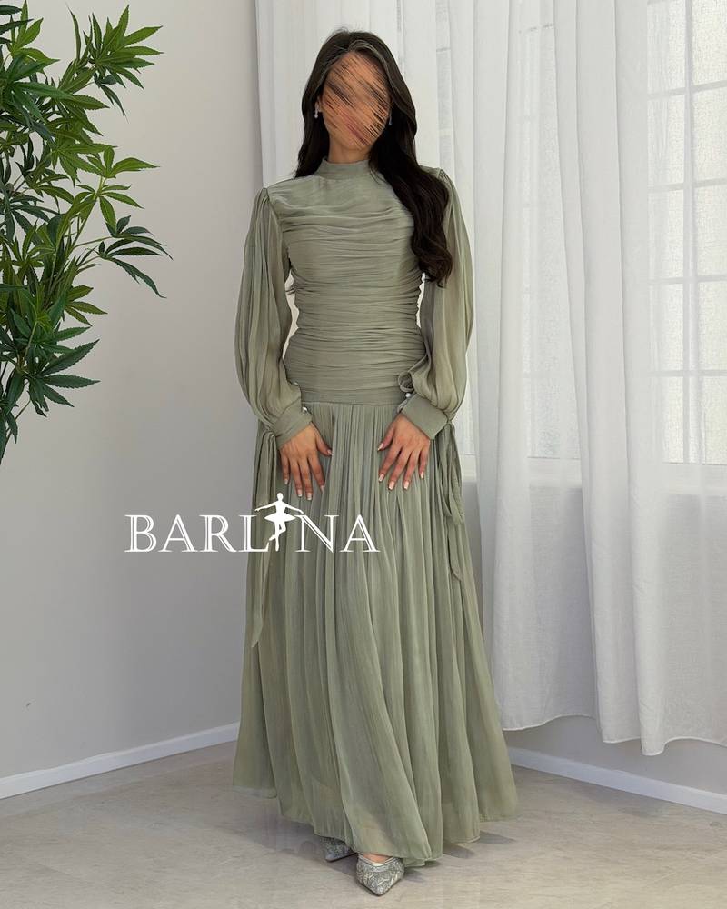 Light green pleated dress in a shiny fabric