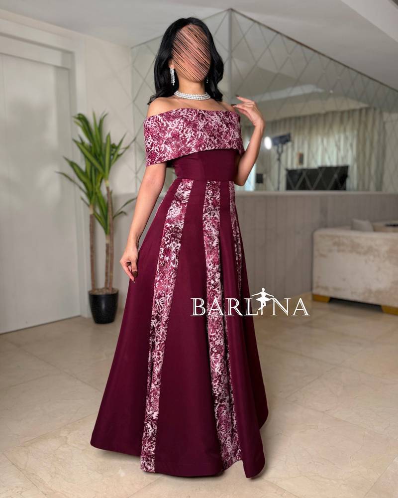 Off-shoulder burgundy dress embroidered with delicate patterns