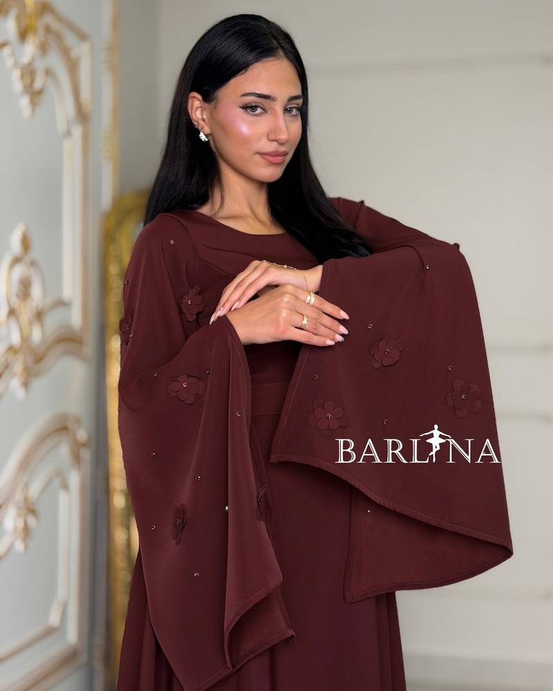 Burgundy dress with sleeves adorned with prominent roses