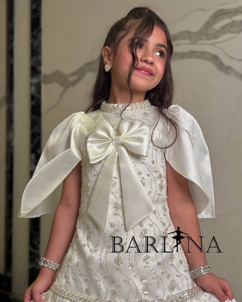 Ivory girls' dress with cape-style sleeves