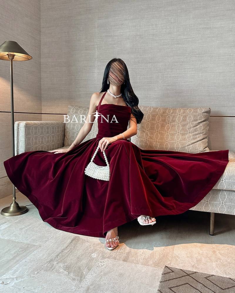 Soft burgundy velvet dress with a tie around the neck