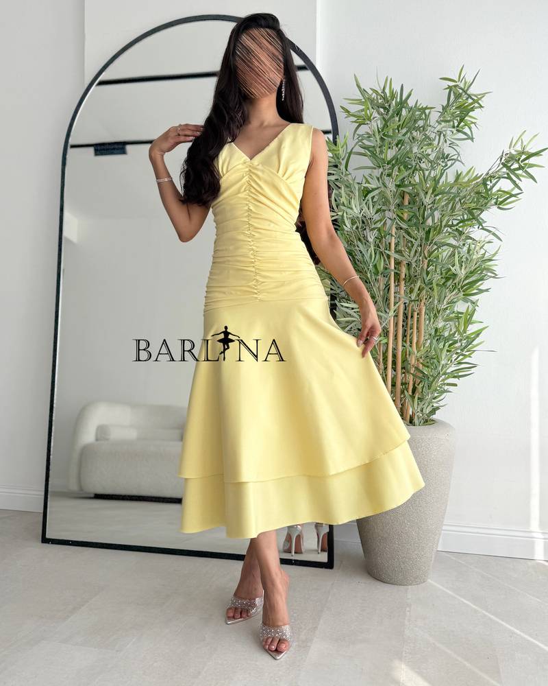 Soft yellow midi dress with two wide layers