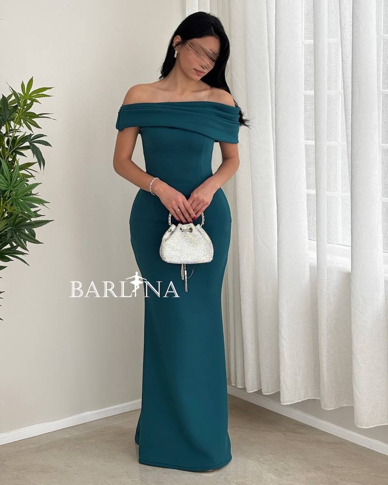 Petrol green dress with shoulder pleats