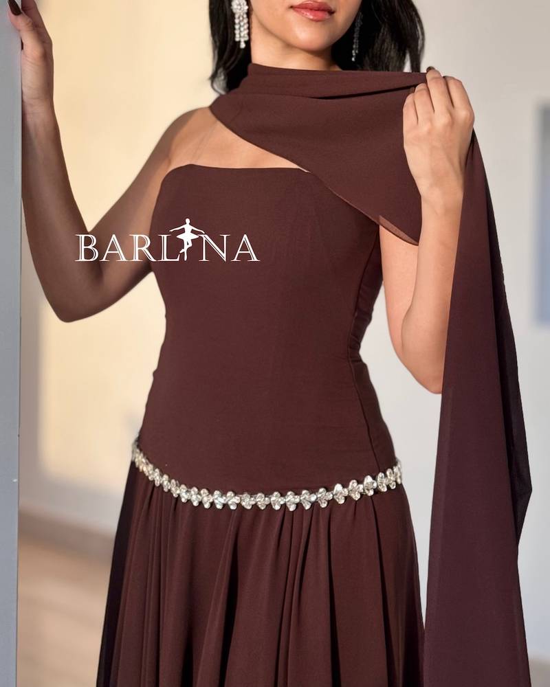 Brown dress with crystals adorning the waist