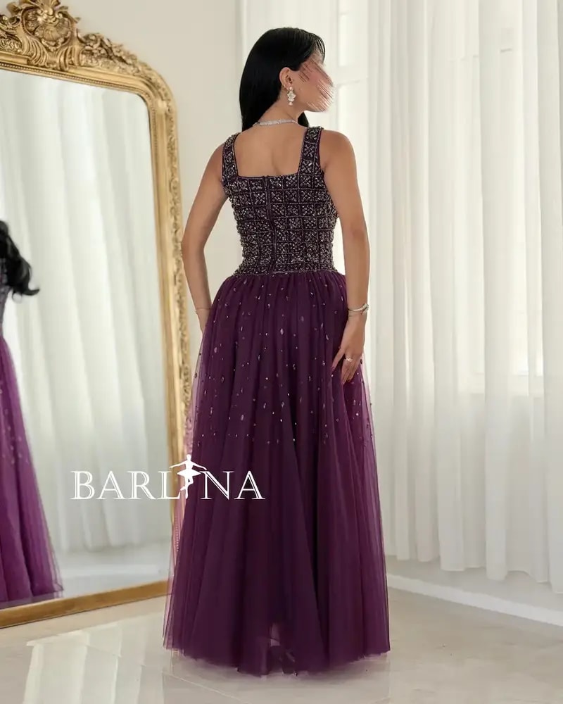 Purple evening dress with elegant embroidery on the top
