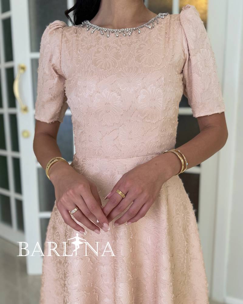 Light beige dress embroidered with delicate lace