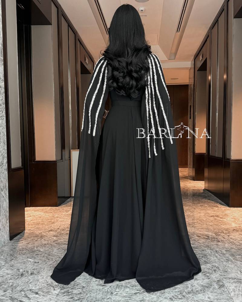 Long black chiffon cape dress decorated with sequins