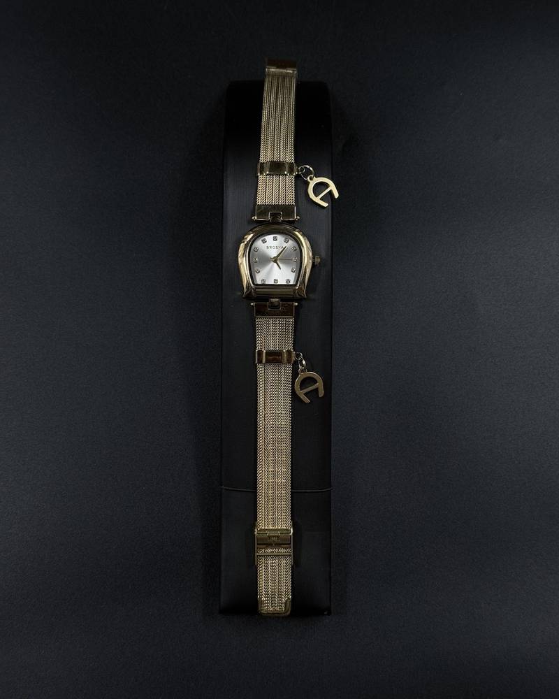 Elegant women's watch adorned with a charm