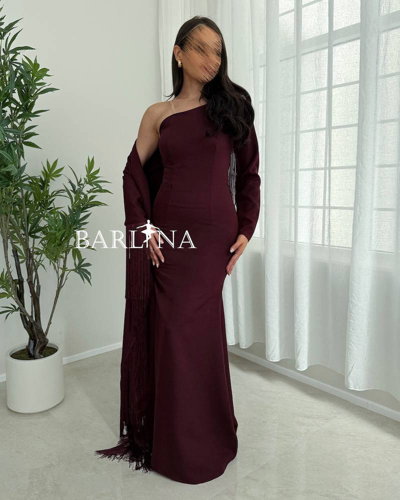 Elegant burgundy dress with a side shawl and tassels