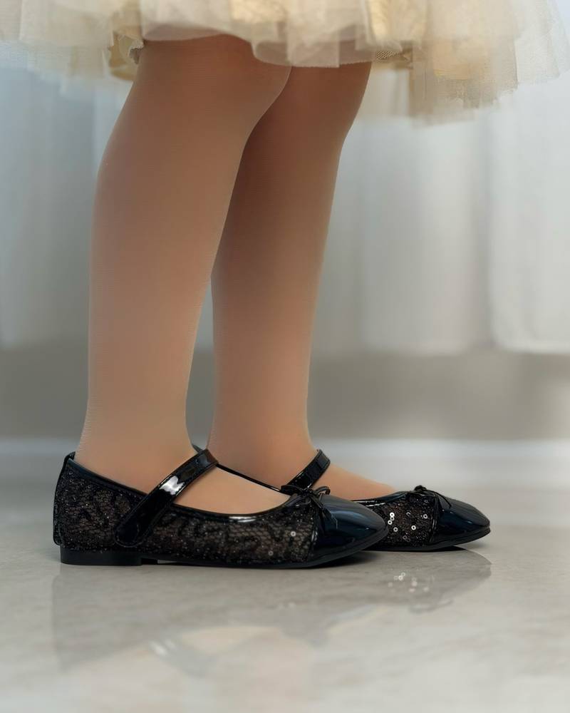 Girls' shoes with a front strap and a lace-up detail