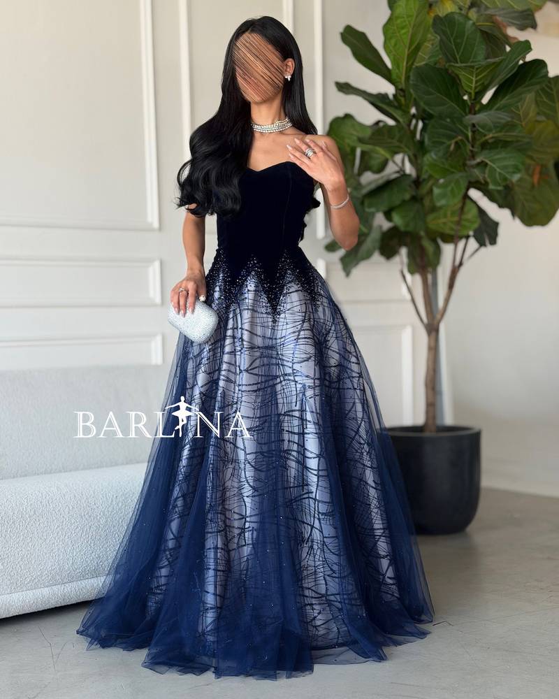 A woven dress with embroidery and shimmering gradients