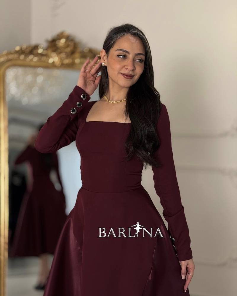 A burgundy midi dress with an elegant