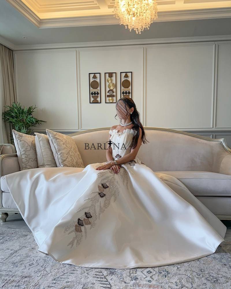 Off white evening dress with brown embellishments