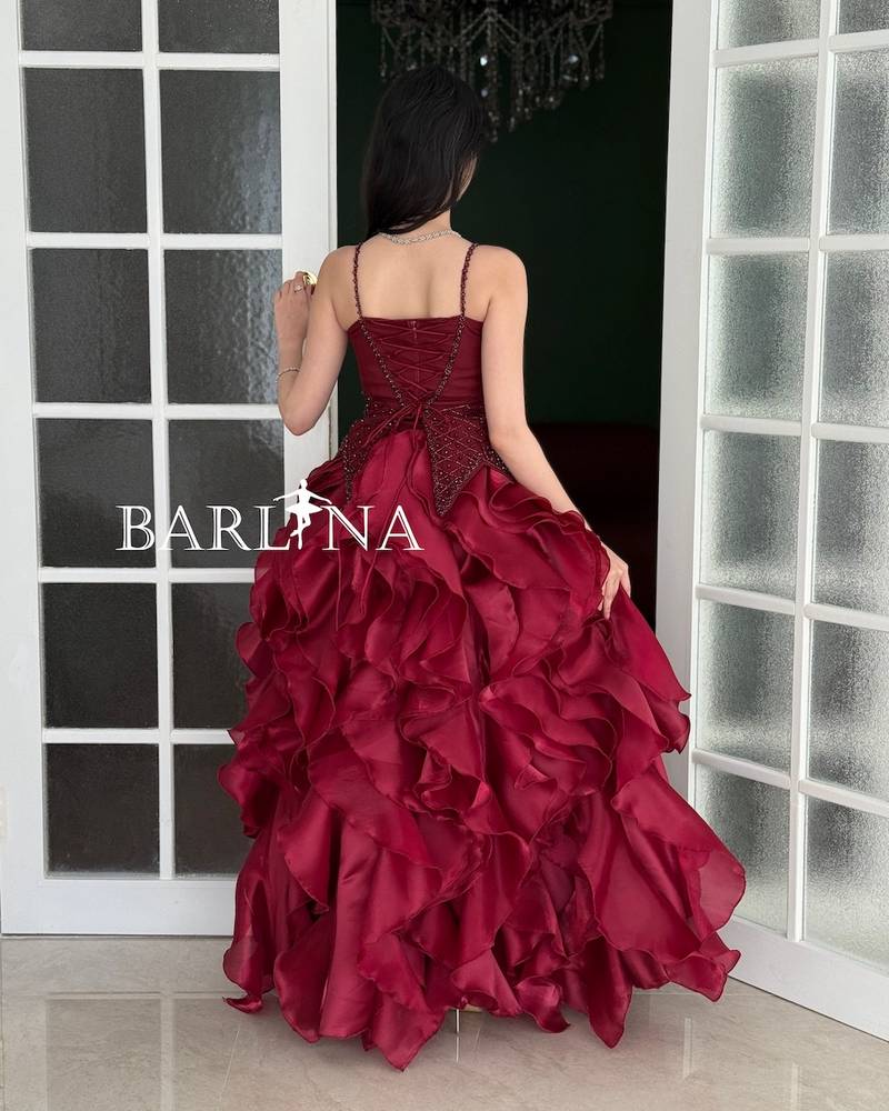 Burgundy evening dress with multiple ruffle layers