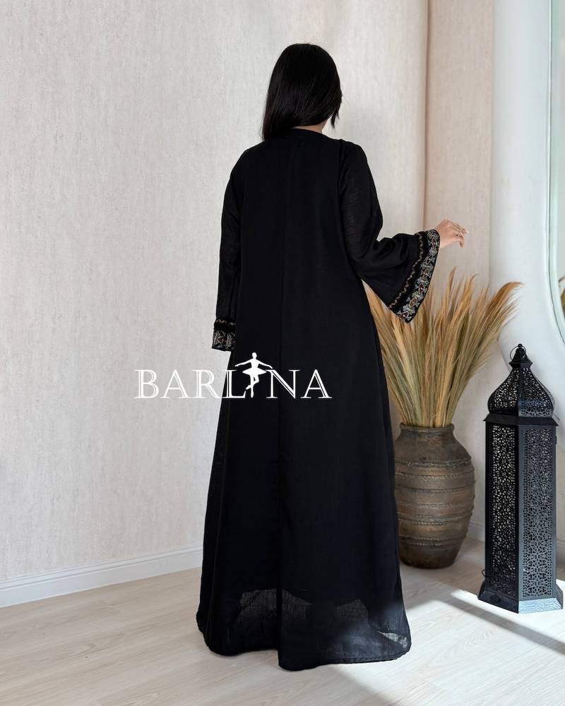 A soft black jalabiya with embroidered edges