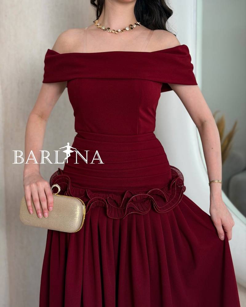 Burgundy dress with ruffles at the waist