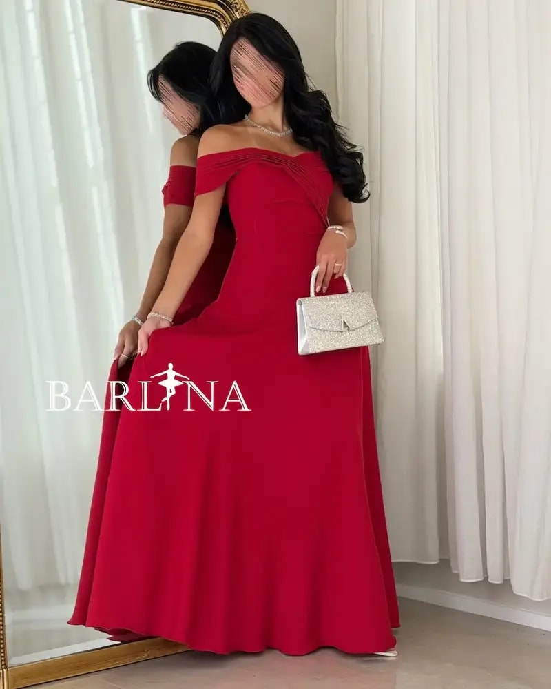 Long red dress with a flowing off-the-shoulder design
