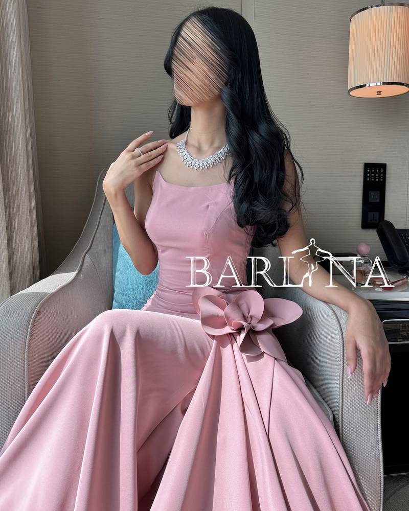 Long pink evening dress with a wide bottom